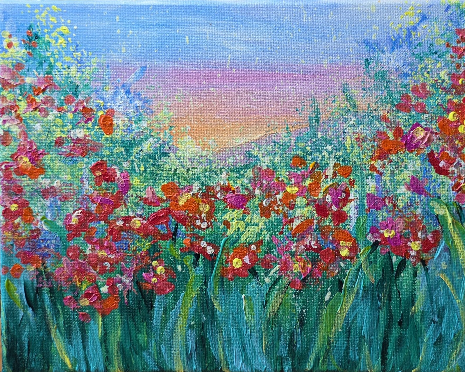 Acrylic painting of a poppy field in red, coral, and magenta under a peach and violet sunrise