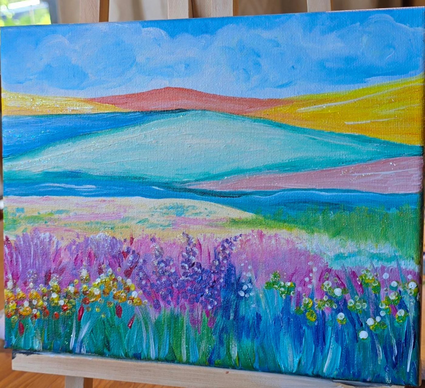 Wildflower Rise on a studio easel